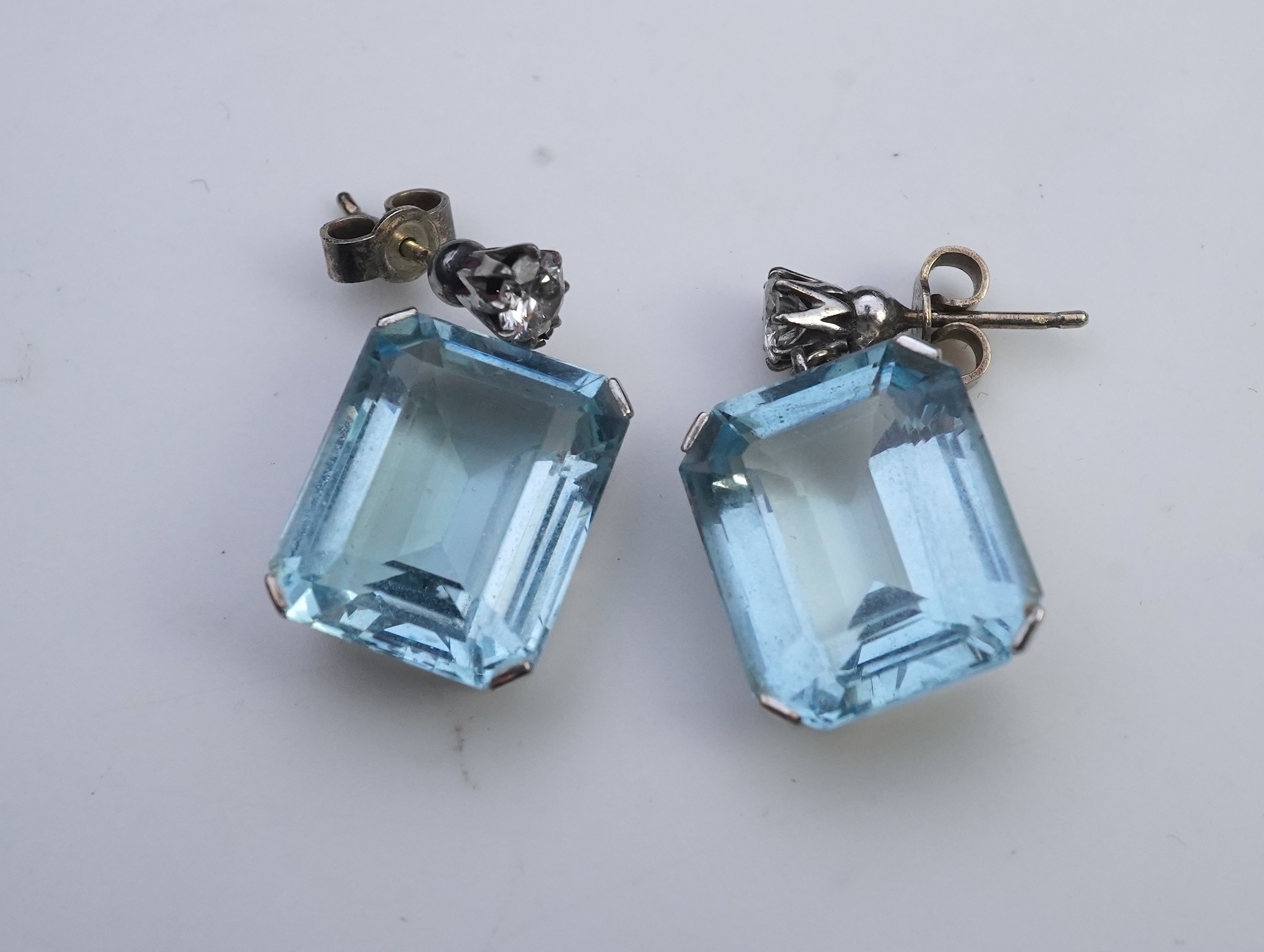 A pair of aquamarine and diamond earrings